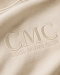 Beige fabric with 'CMC Cool Mums Club' embroidered on it